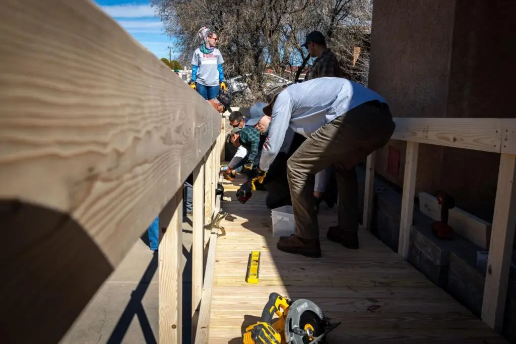 A ramp being built viewed from the top along the railing